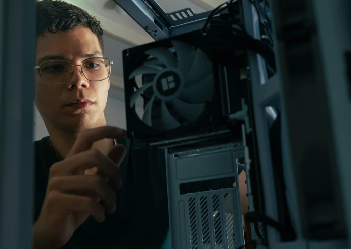 A man is looking at a computer screen